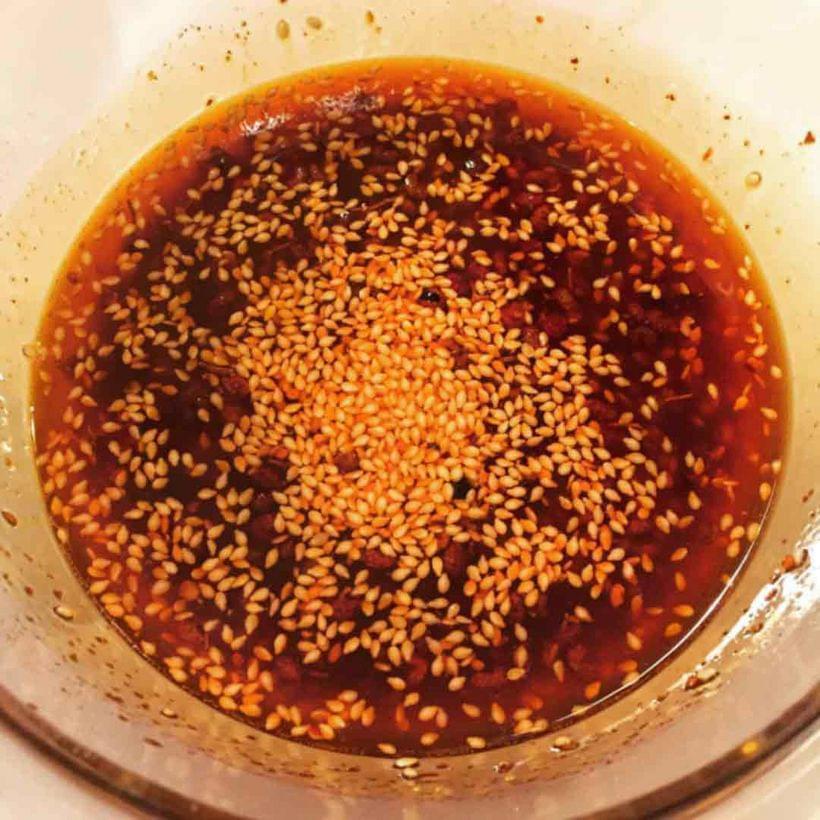 A bowl of bright red chili oil.